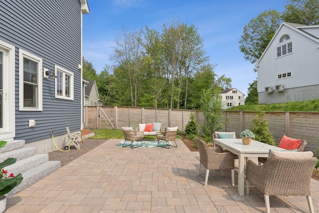 25 Benjamin Way, Portland, ME 04102 - fenced backyard with a patio, outdoor lounge area, and outdoor dining space