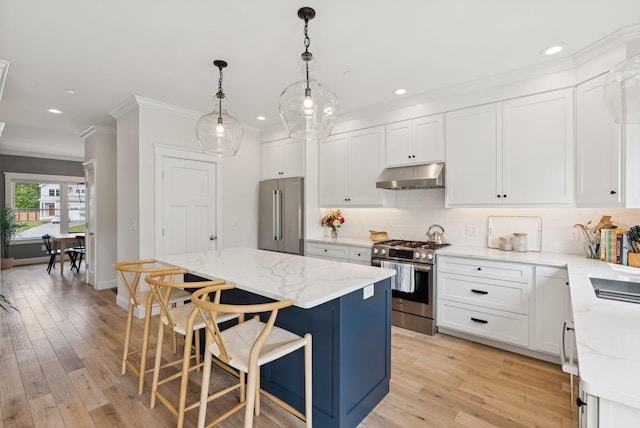 25 Benjamin Way, Portland, ME 04102 - kitchen with stainless steel appliances, under cabinet range hood, crown molding, a center island, and decorative backsplash