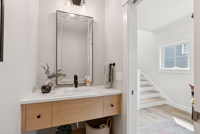 25 Benjamin Way, Portland, ME 04102 - bathroom featuring vanity, wood finished floors, and baseboards