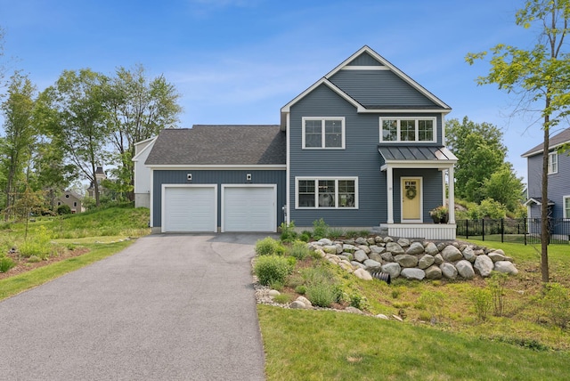 25 Benjamin Way, Portland, ME 04102 - traditional home with a garage, driveway, a standing seam roof, roof with shingles, and board and batten siding