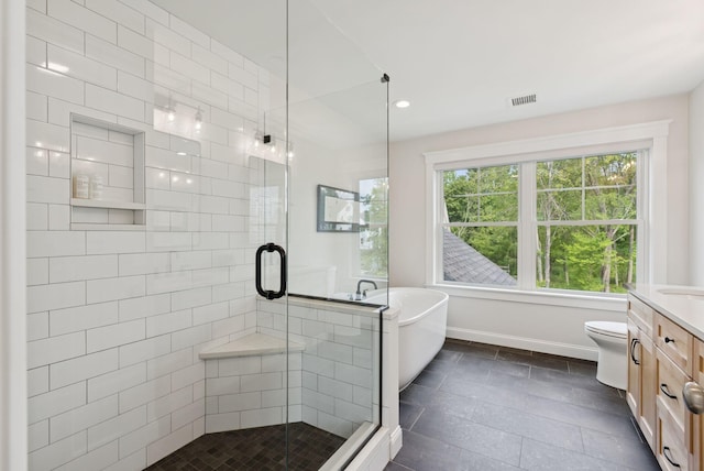 25 Benjamin Way, Portland, ME 04102 - bathroom featuring vanity, healthy amount of natural light, a shower stall, a soaking tub, and recessed lighting