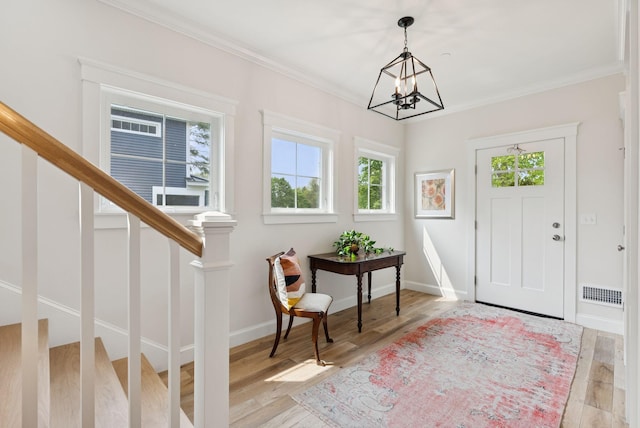 25 Benjamin Way, Portland, ME 04102 - entrance foyer with wood finished floors, stairway, ornamental molding, a chandelier, and baseboards