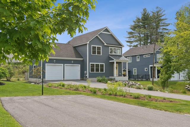 25 Benjamin Way, Portland, ME 04102 - traditional home featuring an attached garage, asphalt driveway, a standing seam roof, and roof with shingles