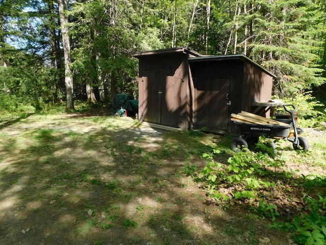 51 Pond Rd, Abbot, ME 04406 - view of shed featuring a view of trees