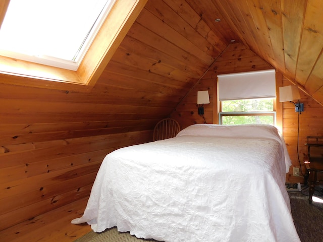 51 Pond Rd, Abbot, ME 04406 - bedroom with wooden walls, wooden ceiling, vaulted ceiling, and a skylight