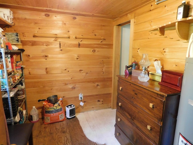 51 Pond Rd, Abbot, ME 04406 - bedroom featuring wood ceiling, wood finished floors, wood walls, and fridge