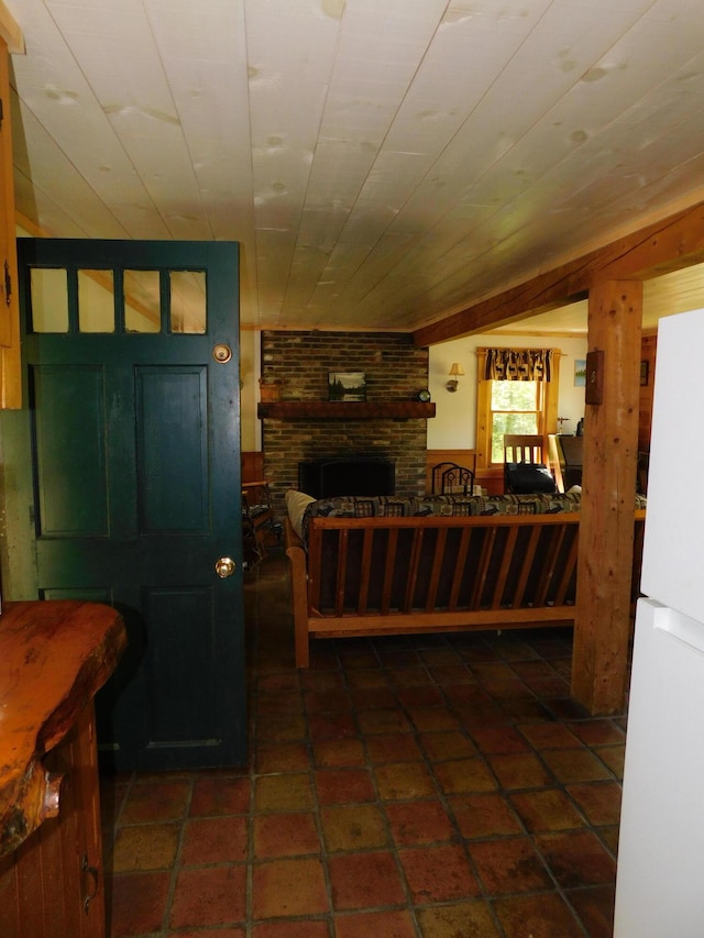 51 Pond Rd, Abbot, ME 04406 - tiled living area with a fireplace