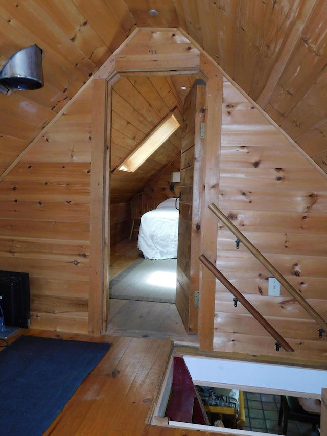 51 Pond Rd, Abbot, ME 04406 - corridor with vaulted ceiling, wood ceiling, wood walls, and wood-type flooring