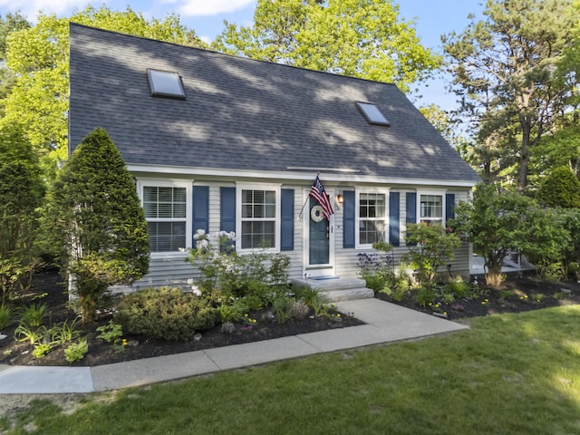 16 Pine Valley Rd, Old Orchard Beach, ME 04064 - cape cod house featuring a front lawn and roof with shingles