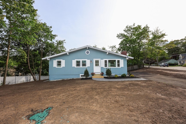 1 Knowlton Rd, Nashua, NH 03063 - view of front of home featuring a chimney and driveway