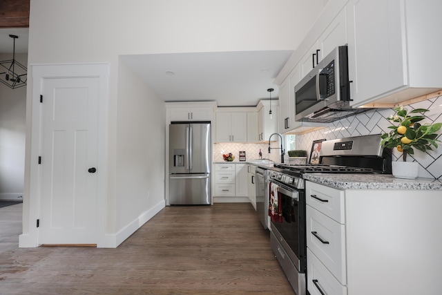 1 Knowlton Rd, Nashua, NH 03063 - kitchen with appliances with stainless steel finishes, a sink, tasteful backsplash, white cabinetry, and dark wood finished floors