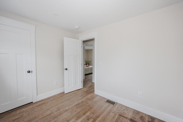 1 Knowlton Rd, Nashua, NH 03063 - unfurnished bedroom featuring baseboards and light wood finished floors