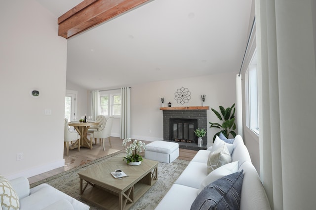 1 Knowlton Rd, Nashua, NH 03063 - living room featuring wood finished floors, baseboards, and a fireplace