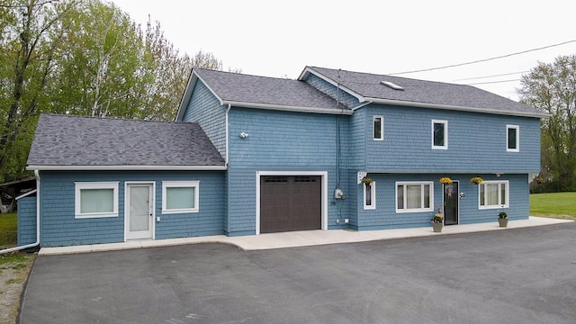 50 Water St, Howland, ME 04448 - view of front of house with asphalt driveway and a shingled roof