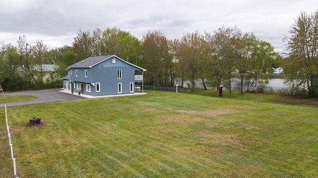 50 Water St, Howland, ME 04448 - view of green lawn featuring asphalt driveway