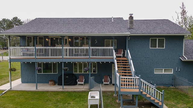 50 Water St, Howland, ME 04448 - back of property with stairs, a lawn, a chimney, a patio area, and a shingled roof