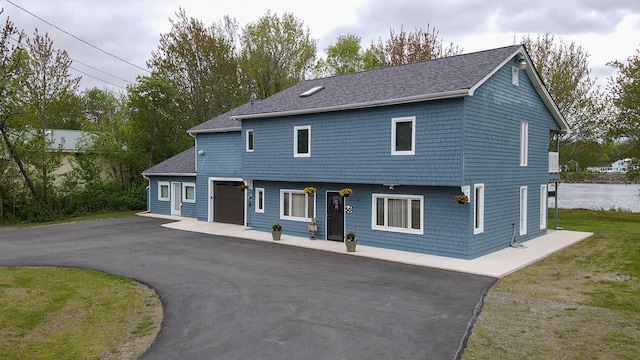 50 Water St, Howland, ME 04448 - view of front of home with driveway and a shingled roof