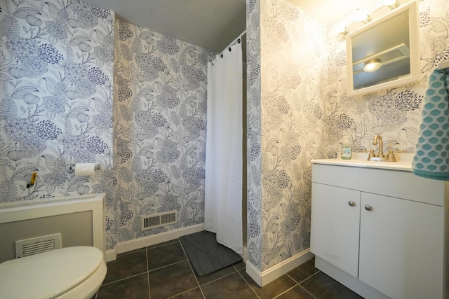 50 Water St, Howland, ME 04448 - bathroom featuring baseboards, tile patterned floors, vanity, and toilet
