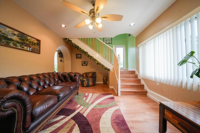 50 Water St, Howland, ME 04448 - living area featuring arched walkways, stairs, light wood-style flooring, recessed lighting, and a ceiling fan