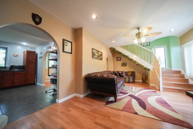 50 Water St, Howland, ME 04448 - living room with arched walkways, healthy amount of natural light, stairs, ceiling fan, and recessed lighting