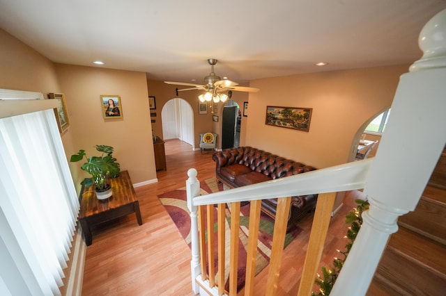 50 Water St, Howland, ME 04448 - stairs with arched walkways, wood finished floors, recessed lighting, and ceiling fan