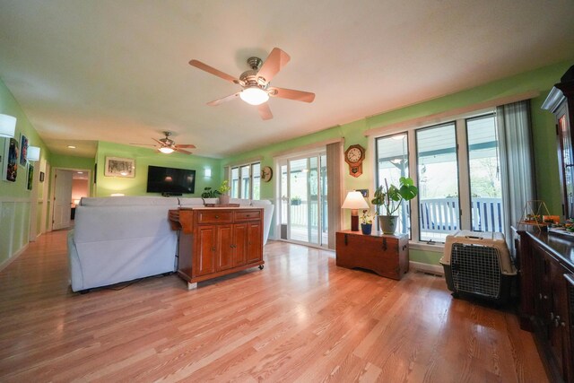 50 Water St, Howland, ME 04448 - living room featuring ceiling fan and light wood-style floors