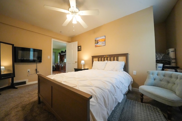 50 Water St, Howland, ME 04448 - bedroom with dark colored carpet, baseboards, and a ceiling fan