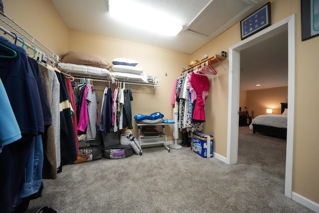 50 Water St, Howland, ME 04448 - spacious closet featuring carpet floors and attic access