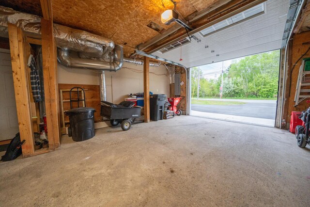 50 Water St, Howland, ME 04448 - garage with electric panel and a garage door opener