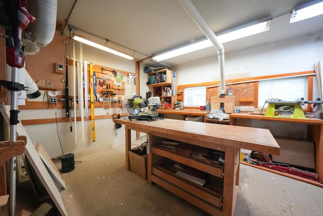 50 Water St, Howland, ME 04448 - basement with a workshop area and baseboards