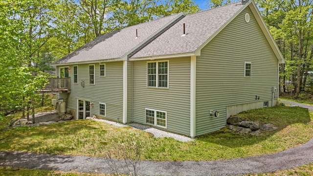 40 Acorn Ridge Rd, Freeport, ME 04032 - view of property exterior with a shingled roof and a lawn