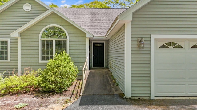 40 Acorn Ridge Rd, Freeport, ME 04032 - doorway to property featuring roof with shingles and an attached garage