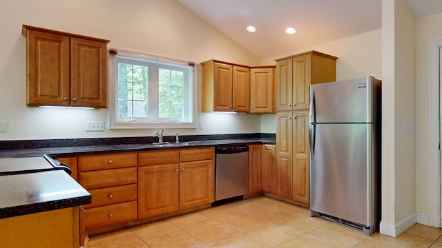 40 Acorn Ridge Rd, Freeport, ME 04032 - kitchen featuring appliances with stainless steel finishes, a sink, vaulted ceiling, light tile patterned floors, and brown cabinetry