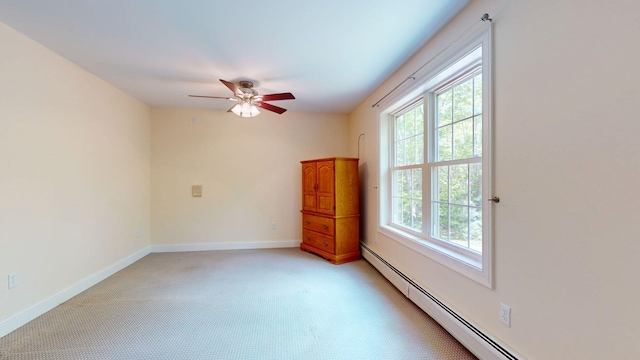 40 Acorn Ridge Rd, Freeport, ME 04032 - empty room with a baseboard radiator, light colored carpet, a ceiling fan, and baseboards