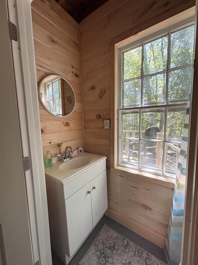 166 Tupper Rd, Madison, ME 04950 - bathroom featuring wood walls and vanity