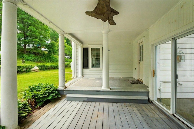 11 Pine Ave, Livermore Falls, ME 04254 - wooden porch with a yard and a ceiling fan