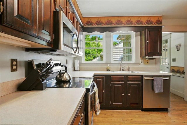 11 Pine Ave, Livermore Falls, ME 04254 - kitchen featuring appliances with stainless steel finishes, light wood-style floors, and light countertops
