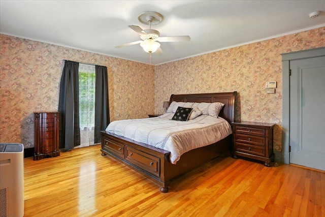 11 Pine Ave, Livermore Falls, ME 04254 - bedroom with light wood-style flooring, crown molding, wallpapered walls, and a ceiling fan