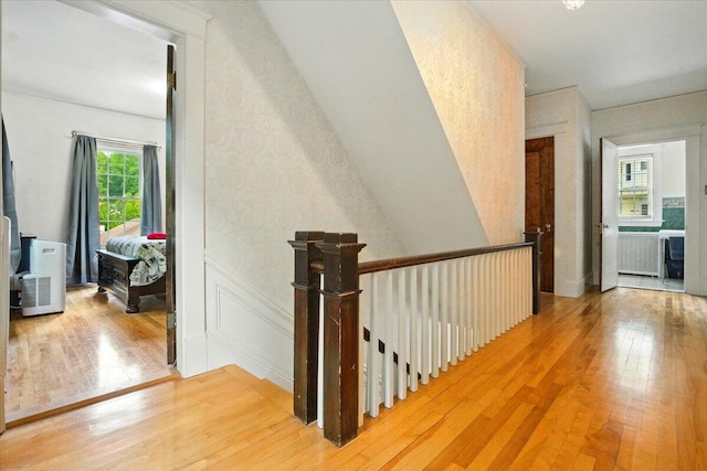 11 Pine Ave, Livermore Falls, ME 04254 - hall with light wood-style flooring and an upstairs landing