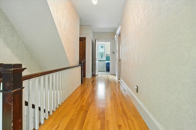 11 Pine Ave, Livermore Falls, ME 04254 - hallway with light wood finished floors and wallpapered walls