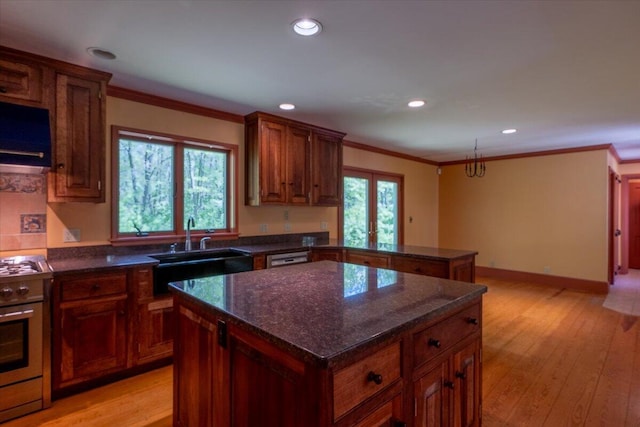 465 S St, Rockport, ME 04856 - kitchen with stainless steel gas range, a sink, crown molding, recessed lighting, and light wood finished floors