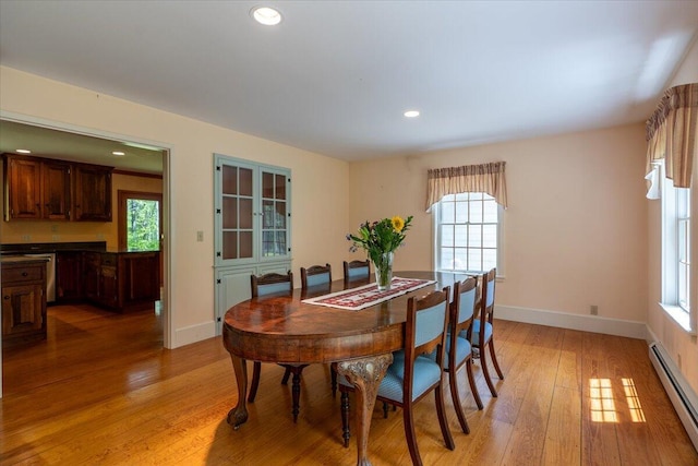 465 S St, Rockport, ME 04856 - dining area with baseboard heating, light wood finished floors, baseboards, and recessed lighting