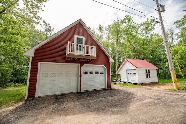 177 Meadow Ln, Smithfield, ME 04978 - garage with a detached garage and view of wooded area