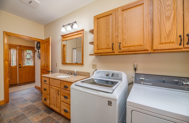 177 Meadow Ln, Smithfield, ME 04978 - laundry room featuring independent washer and dryer, stone finish flooring, and cabinet space