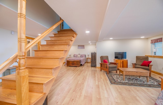 177 Meadow Ln, Smithfield, ME 04978 - living room with wood finished floors, stairway, and recessed lighting