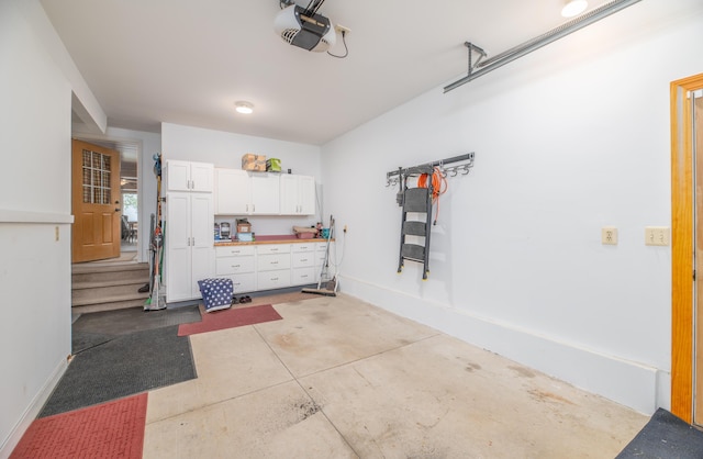 177 Meadow Ln, Smithfield, ME 04978 - garage featuring a garage door opener and baseboards