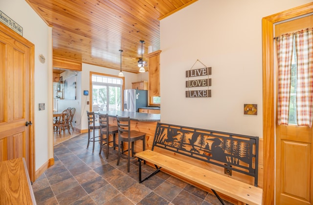 177 Meadow Ln, Smithfield, ME 04978 - dining area featuring wood ceiling, baseboards, and dark stone finish floors