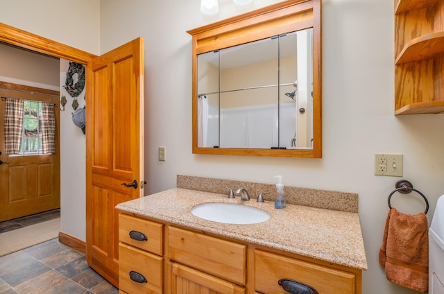 177 Meadow Ln, Smithfield, ME 04978 - full bath with vanity, stone finish floors, baseboards, and curtained shower
