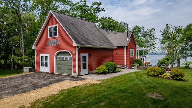 177 Meadow Ln, Smithfield, ME 04978 - view of front of home featuring a garage, driveway, a front lawn, a shingled roof, and a pergola