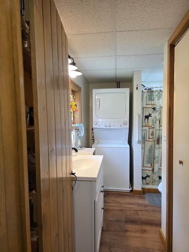 25 Oak Ridge Rd, Shirley, ME 04485 - laundry area featuring estacked washer and dryer and dark wood-style floors